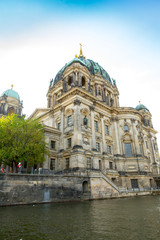 Fototapeta na wymiar Berlin Cathedral next to the Spree River