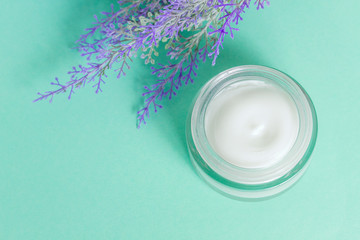 open can of cream on bright green background