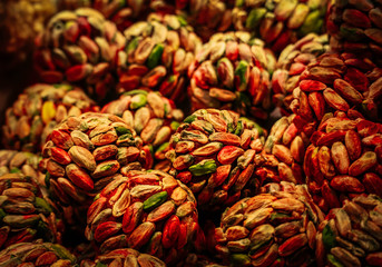 Asian food, pistachio nut balls, Turkish bazaar showcase.