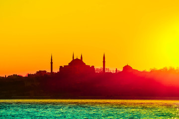 Fototapeta na wymiar Istanbul city view silhouettes. Sunset in Bosphorus. Muslim mosque landscape.