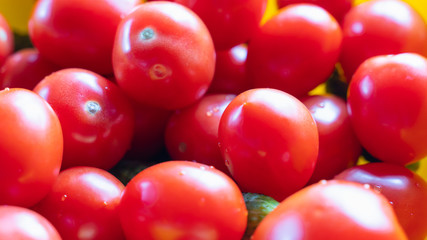 A lot of red tomatoes without branches are a bunch. Background.