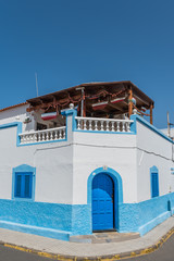 PUERTO DE LAS NIEVES, GRAN CANARIA, SPAIN - MARCH 11, 2019: Street view. View of the facade of the building. Vertical.