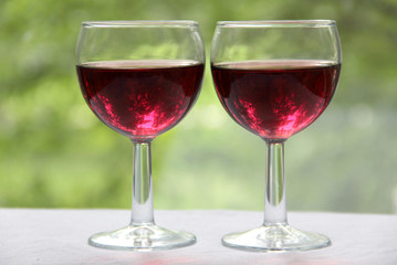 Vintage glass goblet on green background