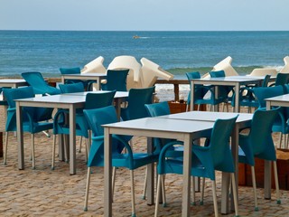 Chairs and tables at a beach cafe