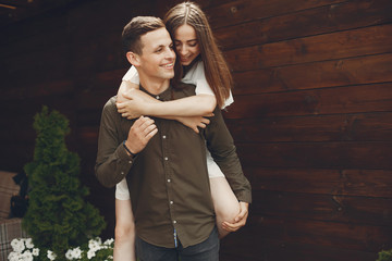 Naklejka premium Cute couple in a city. Lady in a white dress. Boy in a green shirt