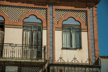 Doors to balcony on building with ceramics tiles at Merida