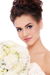 Naklejka premium Young beautiful slim bride with prom makeup and fancy bouckuet