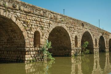 Fototapeta na wymiar Puente Romano arches on the Guadiana River at Merida