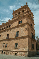 Fototapeta na wymiar People in front of old building facade at Salamanca