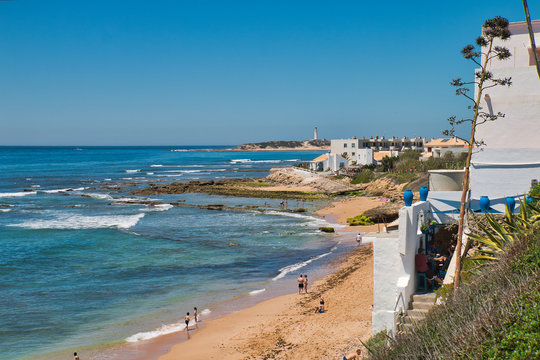First swimmers of the season 2019 on the beach of Los Ca&ntilde;os de Meca, an ideal place to spend the summer on the coast of Cadiz, Spain