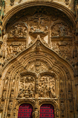 Facade with wooden door on the New Cathedral at Salamanca