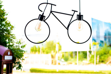 Ceiling lamp. Light fixture made in the shape of a bicycle.