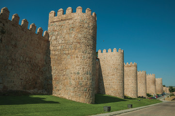 Fototapeta na wymiar Several towers on the large city wall of Avila