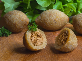 Arabic meat appetizer Kibbeh. Traditional Arabic kibbeh with lamb and pine nuts. Close up