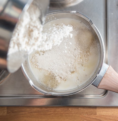 Pouring flour from above. Baking mix