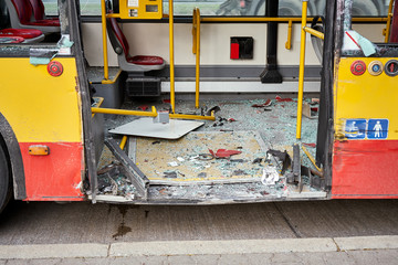 View of devastated city bus after road accident.