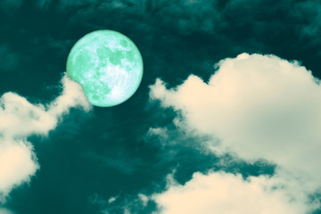 Fototapeta na wymiar green strawberry moon back on silhouette heap cloud on night sky