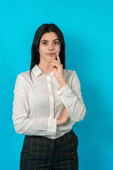 Attractive young girl close-up with big eyes. Business woman look at camera and smile