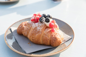 Creamy croissant with berries