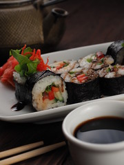 Fresh and tasty sushi on the wooden table
