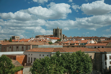 Fototapeta na wymiar Bell tower from gothic Cathedral amid roofs at Avila