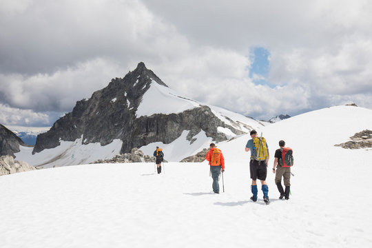 Rear view of four mountaineers approaching Cypress Peak, B.C.