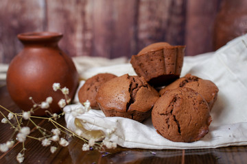 a set of chocolate muffins and a pitcher