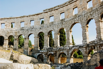 Pula, Croatia - June 10, 2019: Roman amphitheater in Pula, the best preserved ancient monument in Croatia, visited by hundreds of tourists.