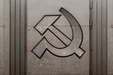 Rusted symbols of the Soviet Union. Hammer and sickle.