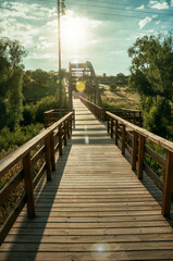 Sunbeam and wooden bridge over the Adaja River at Avila