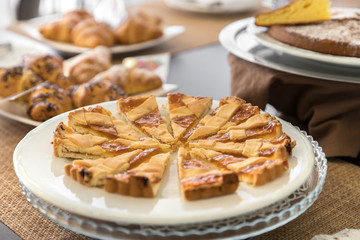 Breakfast buffet table with homemade cake and croissant