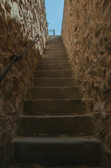Staircase going up towards a thick wall in Avila