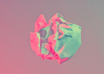 Minimalism Business concept. Unrealized idea. Crumpled paper ball in neon pink blue light