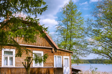 Wooden cottage near water