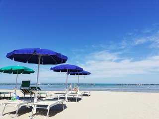 Colorful Beach Umbrellas on a Sunny Summer Day by the Italian Coast