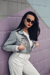 Beautiful Brunette Girl in Sunglasses White Pants and Jeans Jacket, Red Lipstick