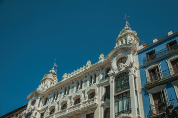 Fototapeta na wymiar Colorful buildings full of windows and balconies in Madrid