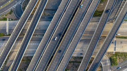 Aerial top view of highway, Transport city junction road with car on Intersection cross road shot by drone