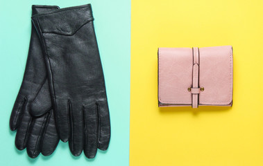Women's fashion accessories on a pastel color background. Purse, gloves. Minimalistic fashion concept. Top view