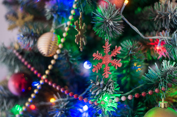 Obraz na płótnie Canvas Christmas tree decorated with toys, balls and garland. Close up. Selective focus.