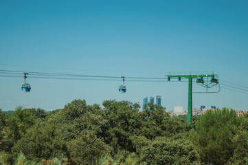 Cable car gondola and big supporting towers at the Teleferico Park of Madrid