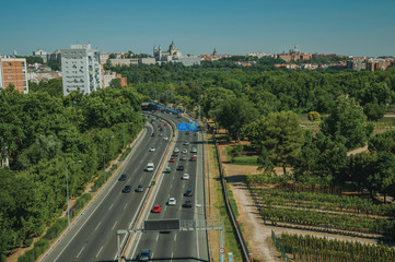 Fototapeta premium Highway with heavy traffic and trees in Madrid