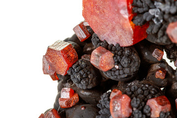 Macro mineral stone Vanadinite on a white background