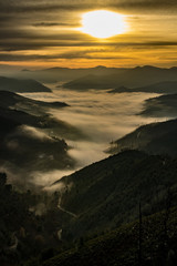 sunset in the mountains with fog
