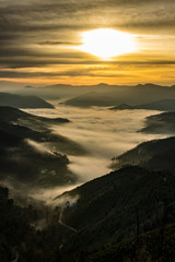 sunset in the mountains with fog
