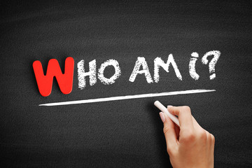 Who Am I? text on blackboard, concept background