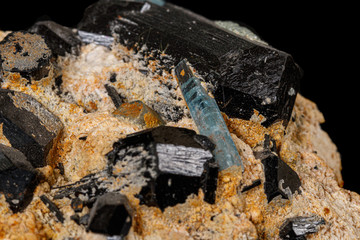 Macro stone mineral tourmaline aquamarine with a black background