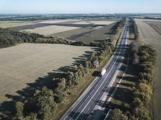Aerial Top View of Truck with Cargo Semi Trailer Moving on Road in Direction