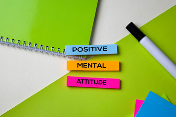 Positive Mental Attitude text on top view office desk table of Business workplace and business...