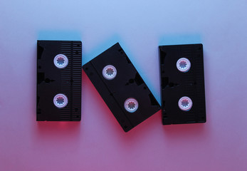 Retro style, 80s. Video cassette. Neon light, top view